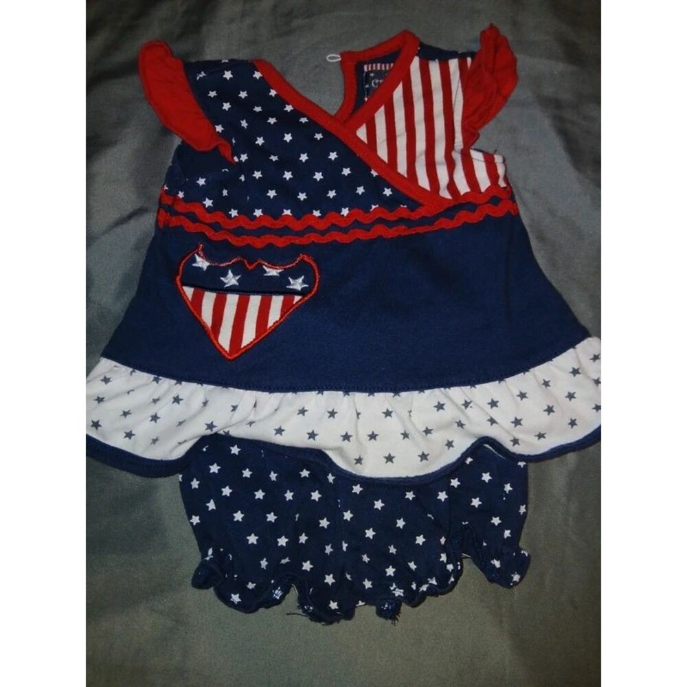 patriotic-themed outfit for a baby girl featuring a stars and stripes design. 6m